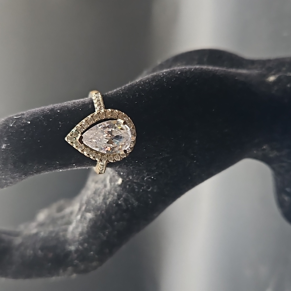G-6 Silvertone ring with pear cut clear stone with clear accents
